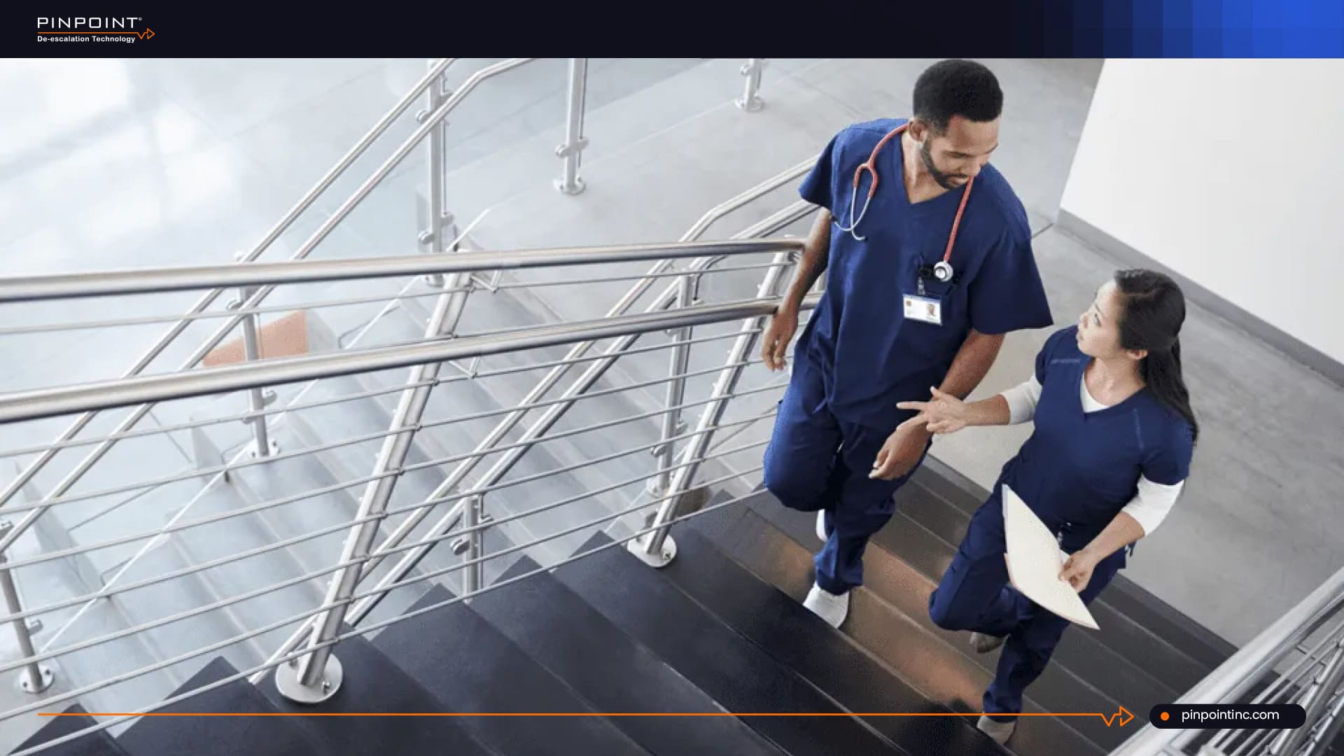 Nurses discussing healthcare safety and privacy in a hospital stairwell