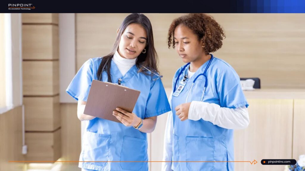 Nurses reviewing safety information to address rising workplace violence in healthcare