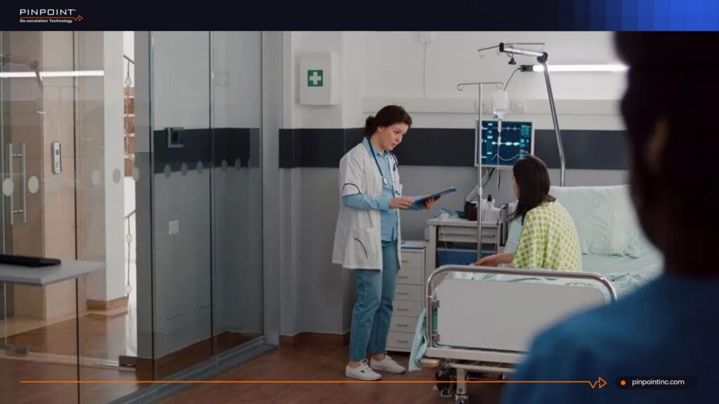 Doctor speaking with patient in hospital room about RFID interference with medical devices