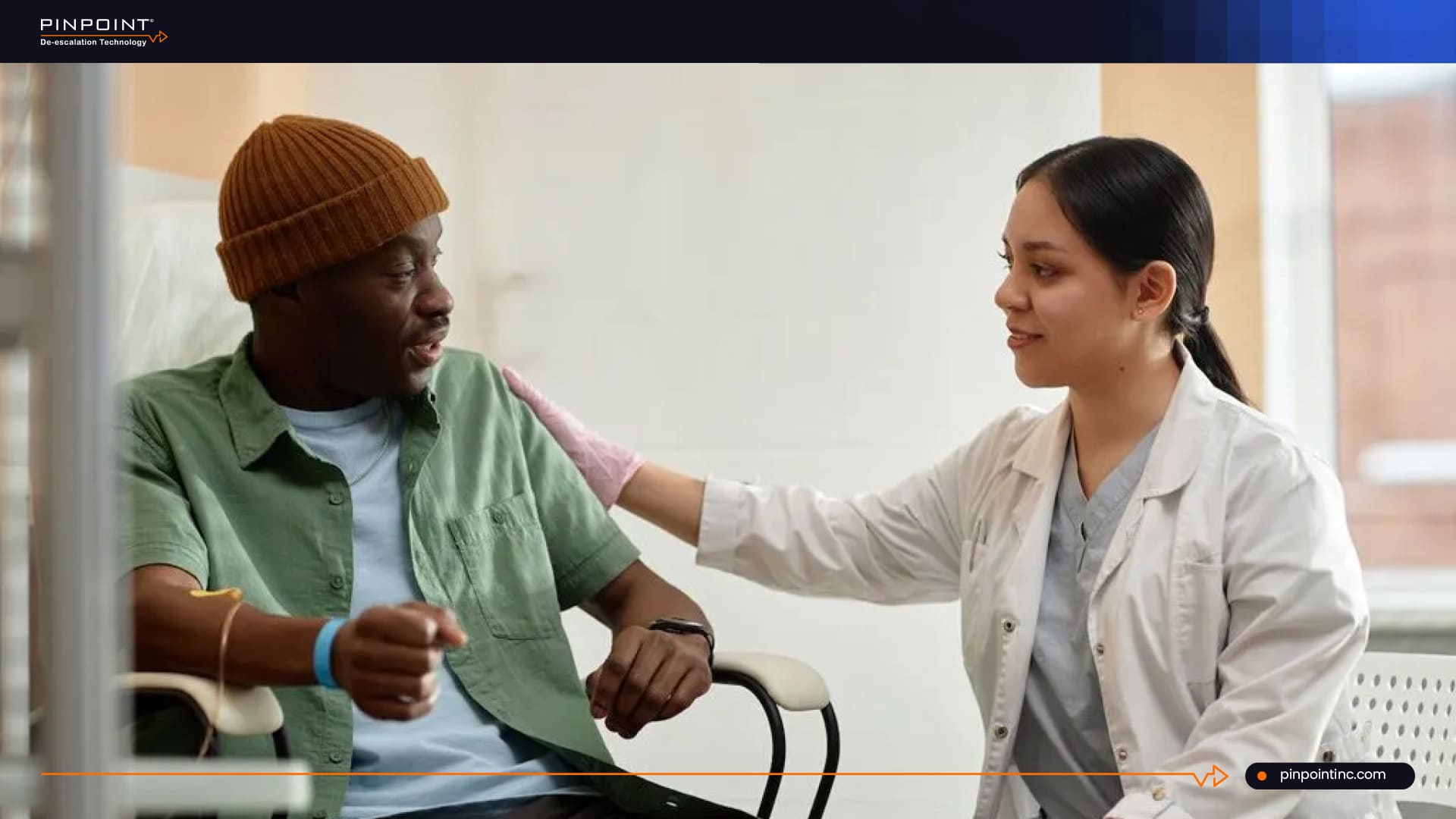 Doctor reassuring patient in hospital room using nurse call system support