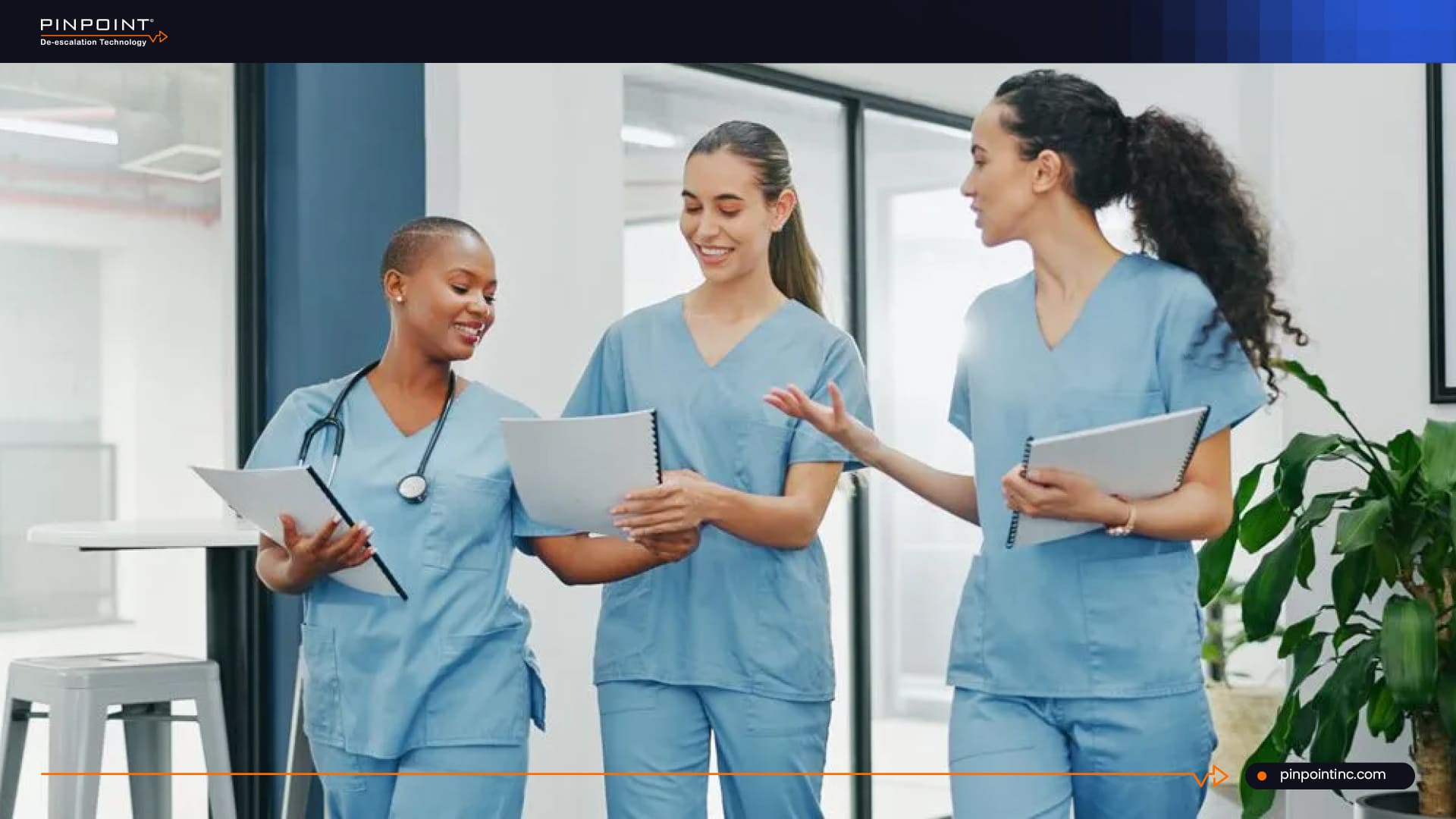Nurses collaborating in a hospital to improve workplace safety and reduce turnover