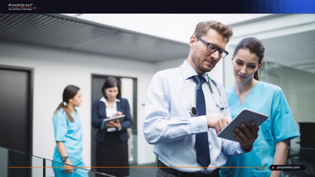 Pinpoint De-escalation Technology blog cover titled 'What Is a Wearable Panic Button? And Why Healthcare Needs One That Doesn't Track' on a dark navy blue background.
